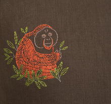 Load image into Gallery viewer, An upclose image of the embroidered orangutan.