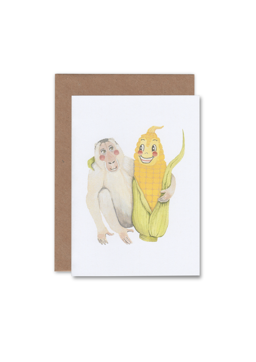 A greeting card lying flat on an envelope with an illustration of a monkey and anthropomorphic  corn looking at each other, and their arms around one another.