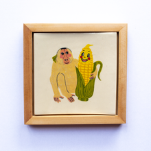 Load image into Gallery viewer, Framed ceramic art tile with an illustration of a monkey and anthropomorphic  corn looking at each other, and with their arms around one another.
